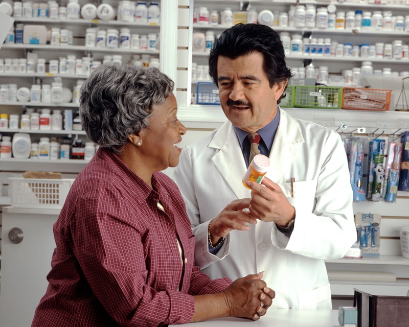 Pharmacist with patient